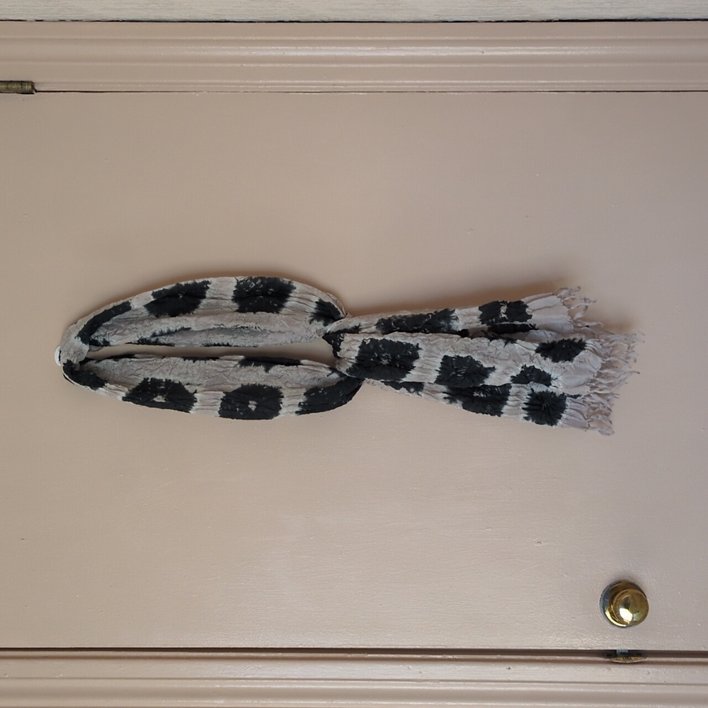 Handcrafted black and cream silk scarf with soft texture and fringe detail